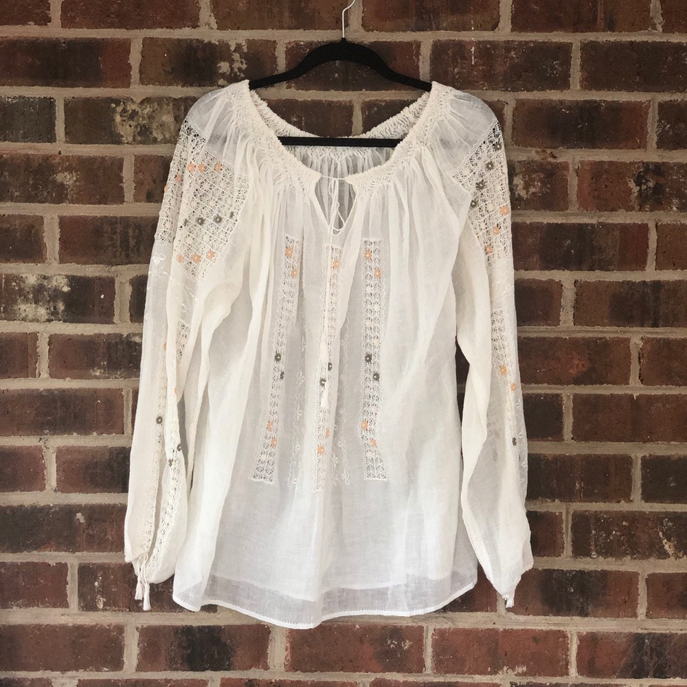 Cream tunic blouse with crochet flower detail